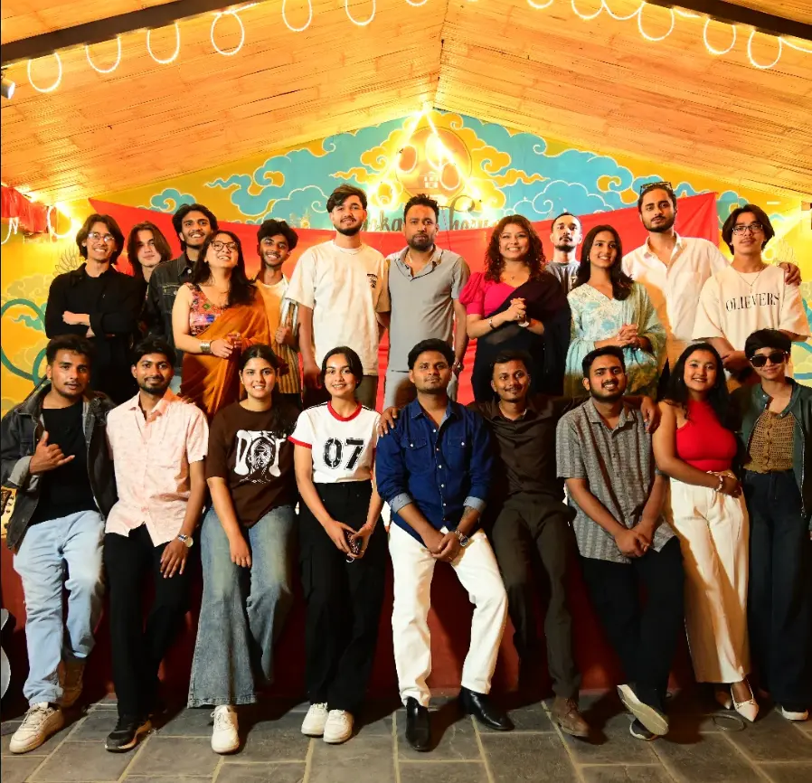 The Karwaan team and performers gathered under warm festival lighting